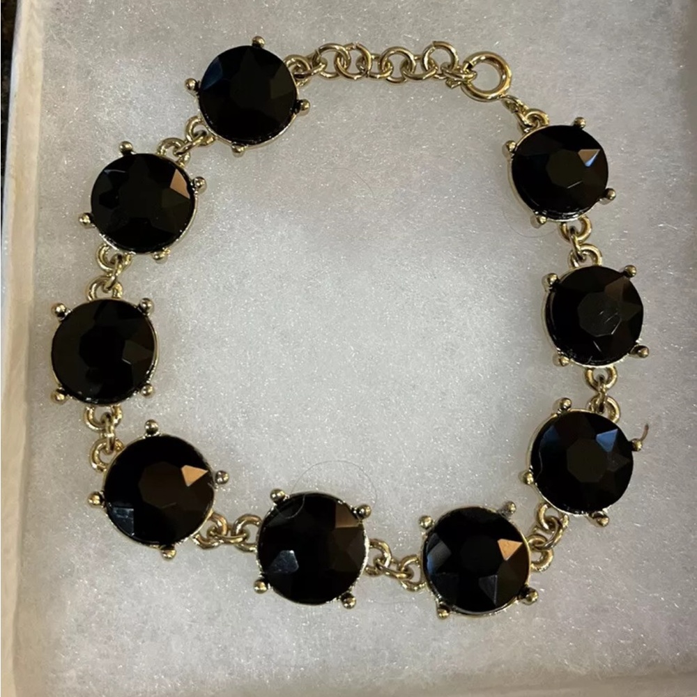 gold tone bracelet with round black gemstones 8”